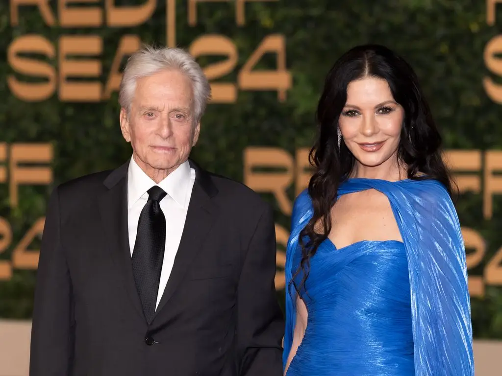 Bikini-clad Catherine Zeta-Jones kisses Michael Douglas in dreamy ocean photo to celebrate their joint birthdays3