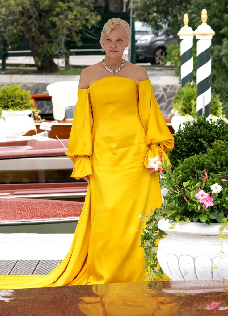 Pamela Anderson commands attention in bold yellow off-the-shoulder gown3