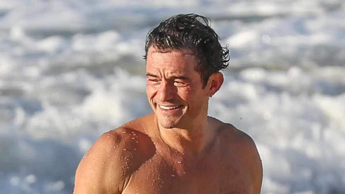 Shirtless Orlando Bloom looks ripped in James Bond-worthy beach appearance0